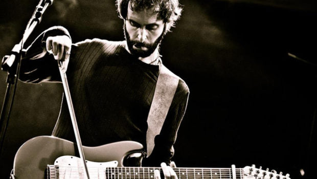 Giancarlo Erra playing guitar